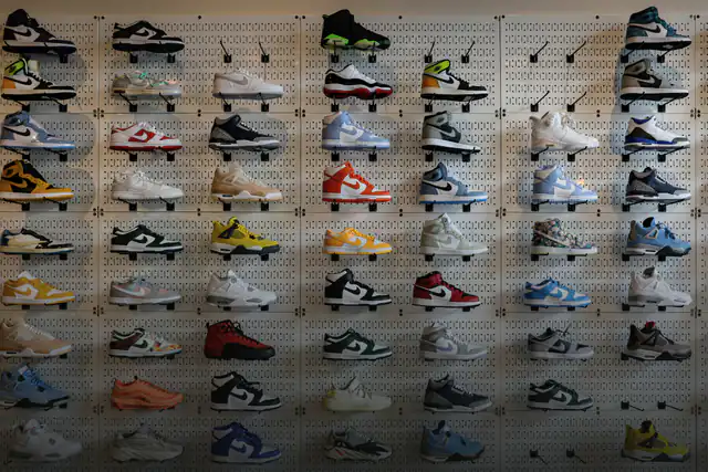 Wall of sneakers on a pegboard display